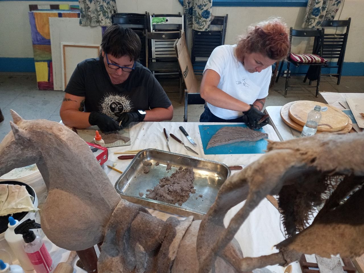 Andre Aghasi's collaborative sculpture workshop, shaping clay forms