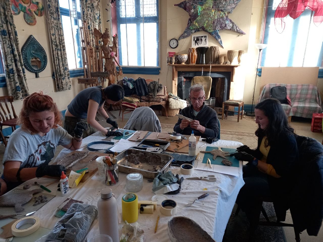 Workshop group carving and finishing sculptural pieces